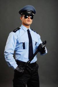 young-policeman-poses-uniform-nightstick-gray-background-44256641.jpg